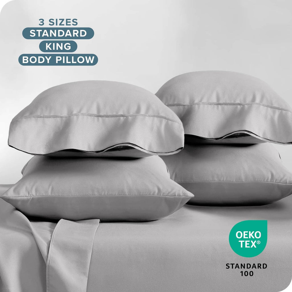 Light gray microfiber pillowcases, standard queen size, stacked with envelope closures