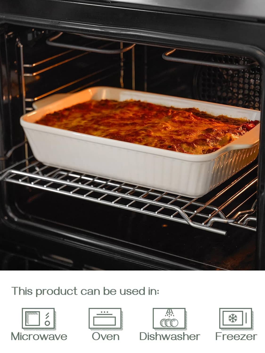 White ceramic lasagna pan baking in oven, rectangular with ribbed sides and rim.