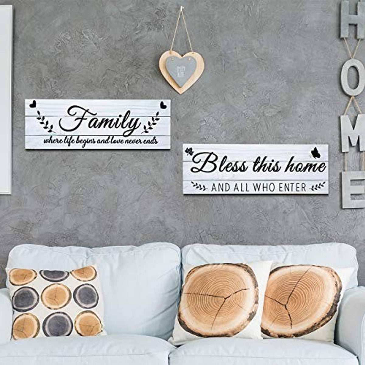 Rustic wooden wall signs reading “Family” and “Bless this home” with butterfly icons
