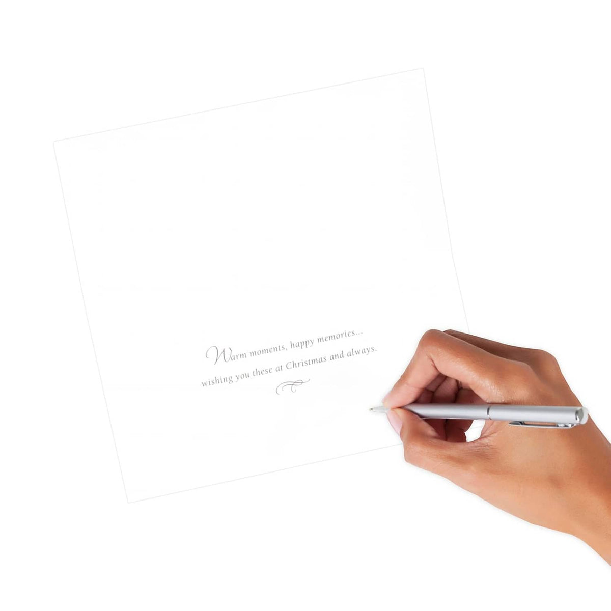 Blank Christmas card insert with printed message and hand writing with a pen
