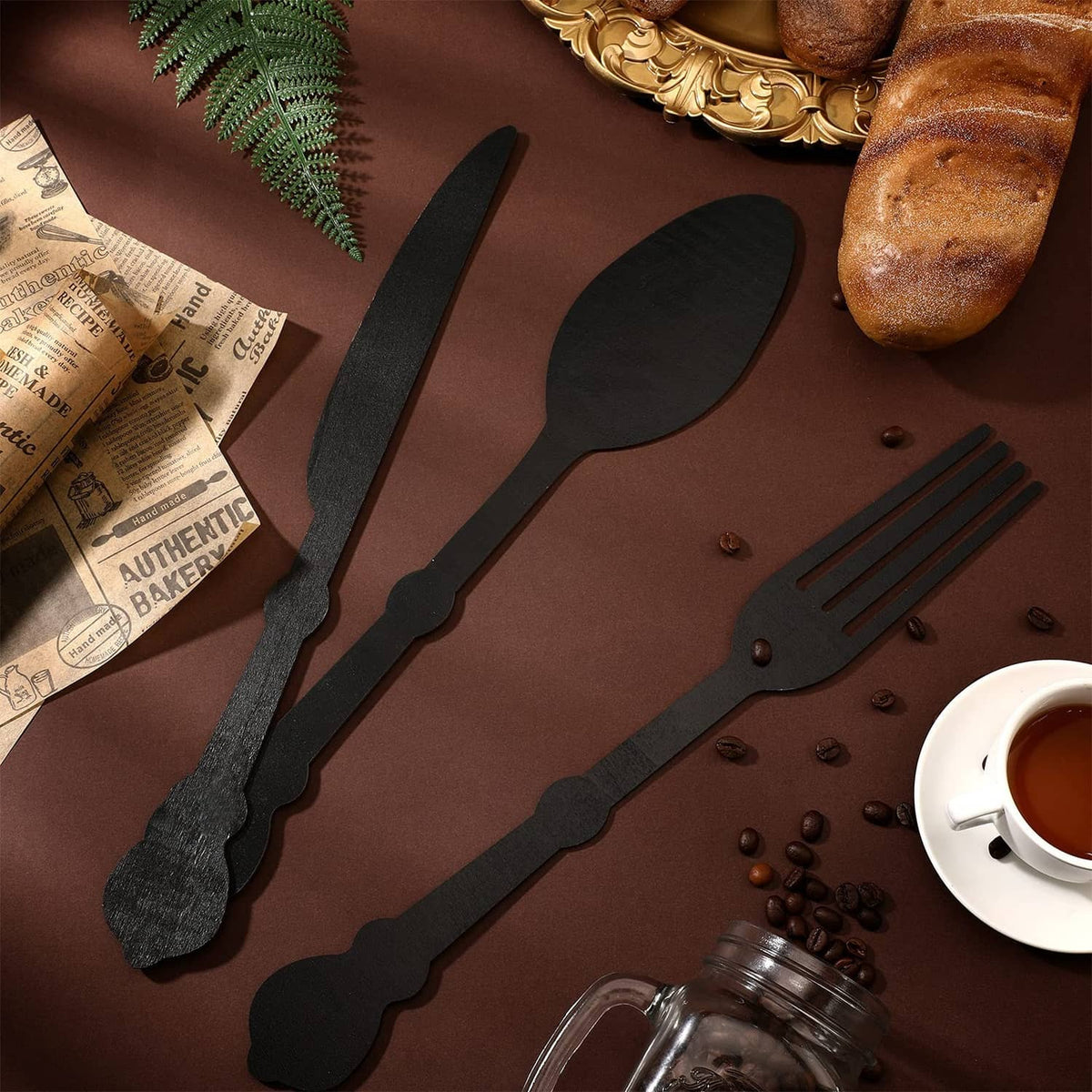 Black wooden knife, fork, and spoon wall decor set with rustic, matte finish