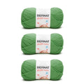 Three grass green Bernat Softee Baby yarn skeins with labels, DK weight acrylic