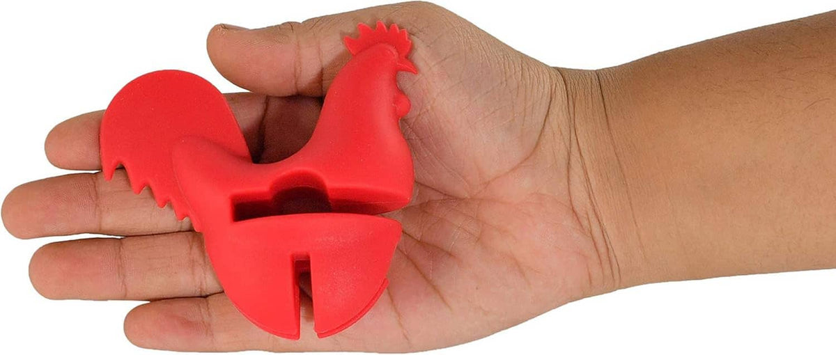 Red rooster spoon holder held in hand