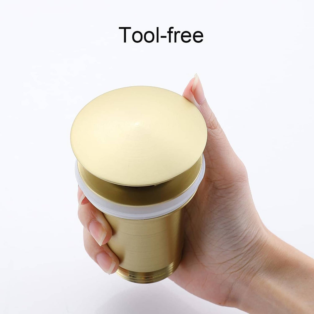 Brushed gold brass pop-up drain stopper cap with white gasket ring