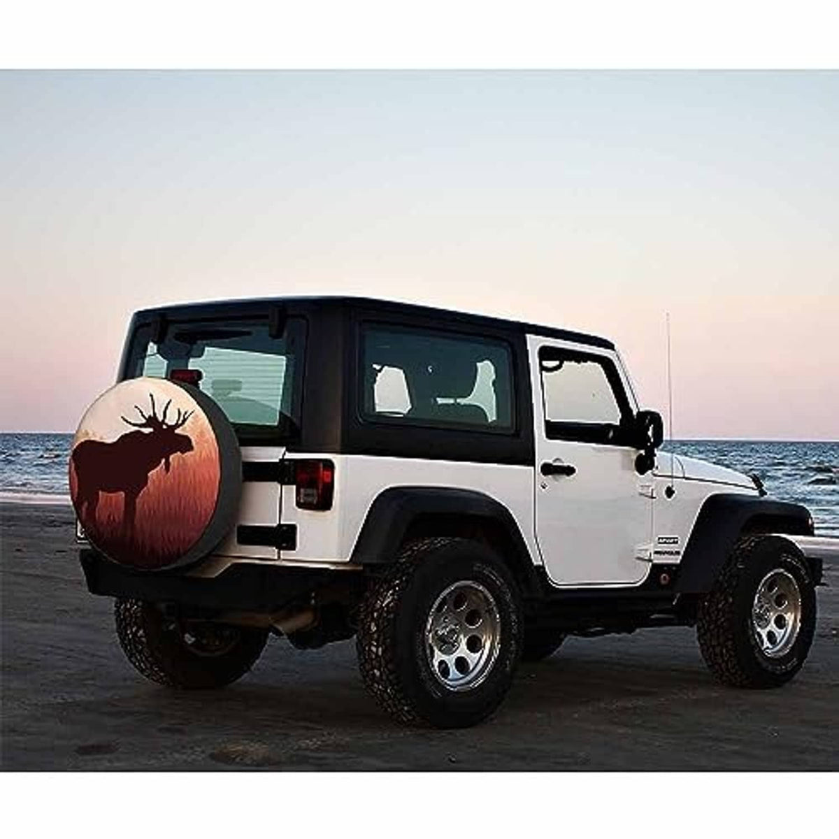 Moose spare tire cover on a white off-road SUV, round moose sunset graphic