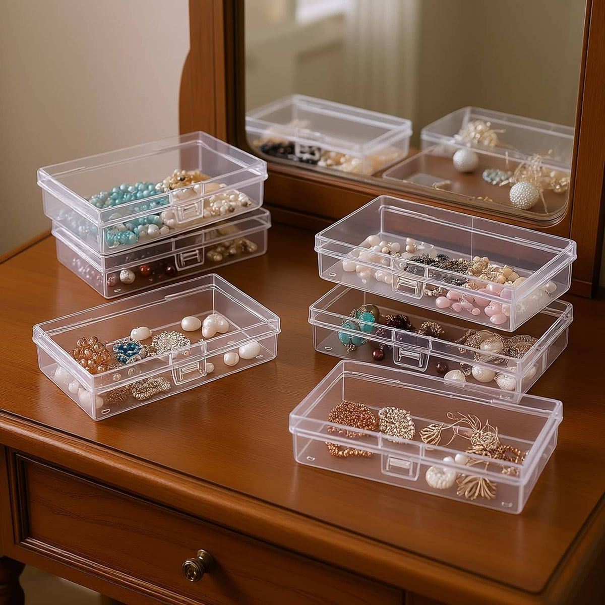 Clear rectangular organizer boxes with snap lids, filled with beads and jewelry parts