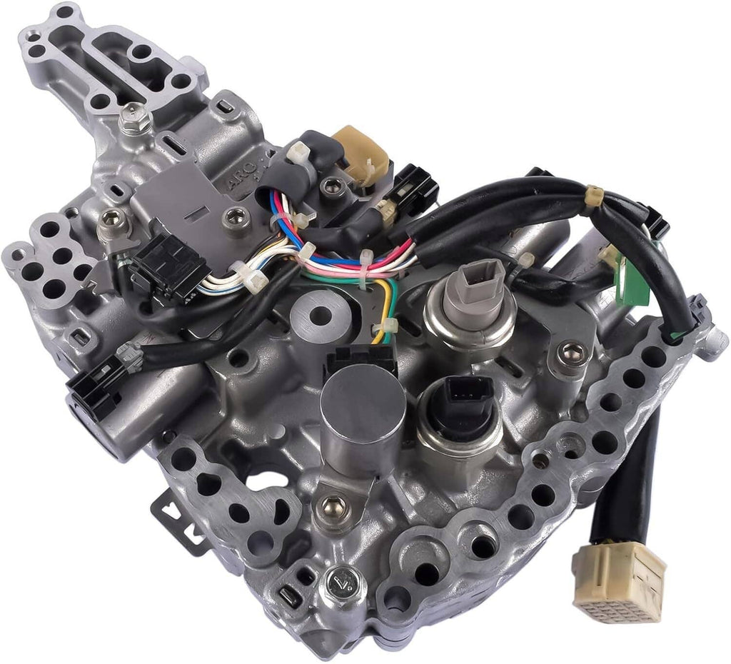 CVT transmission valve body with solenoids, close view of wiring harness and ports