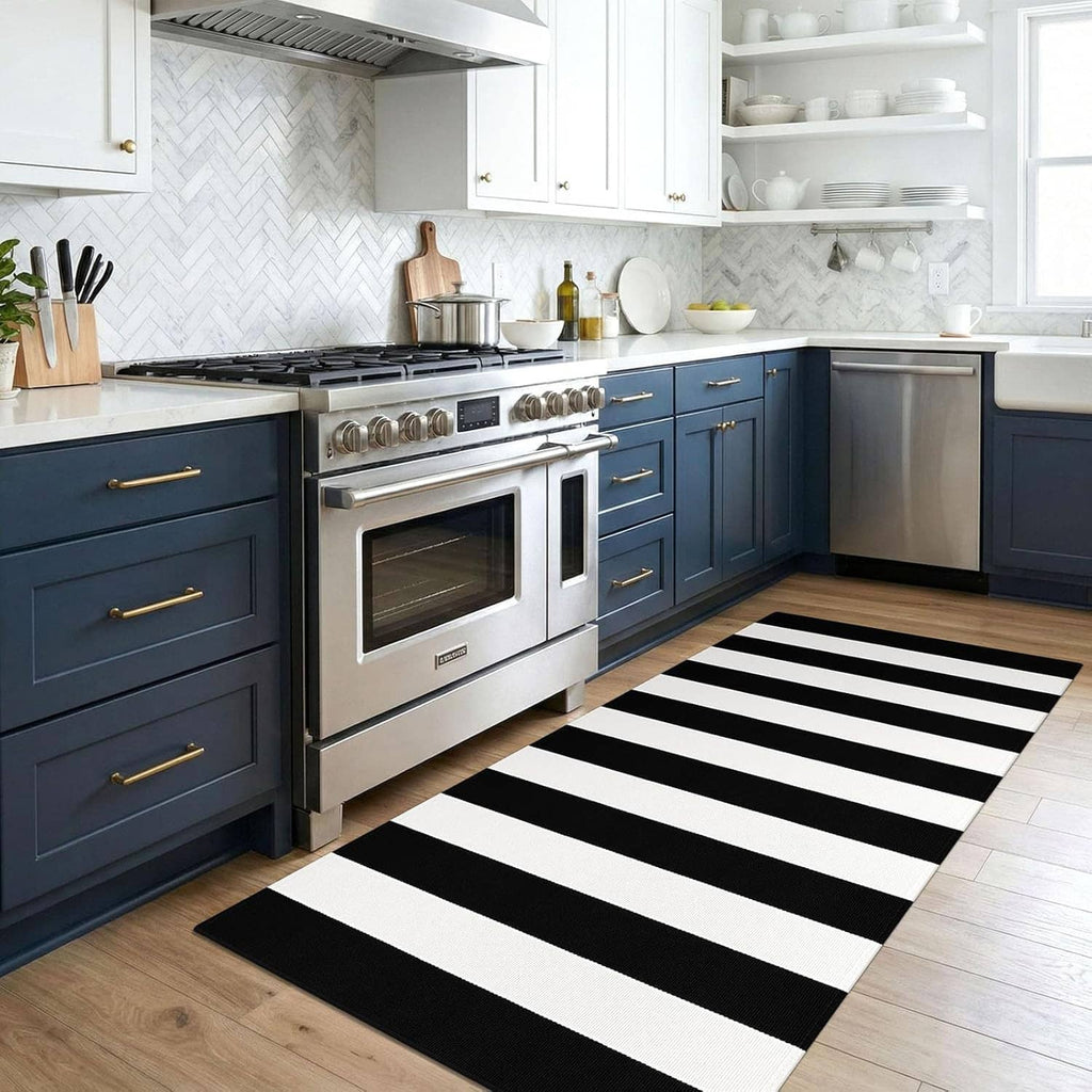 Black-and-white striped area rug in a kitchen, centered on the floor near cabinetry.