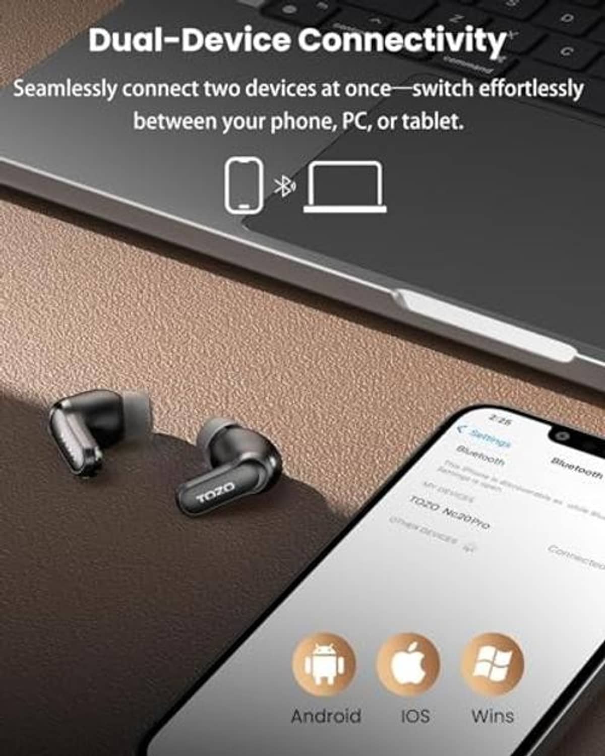 Black wireless earbuds near smartphone screen, charging case on desk