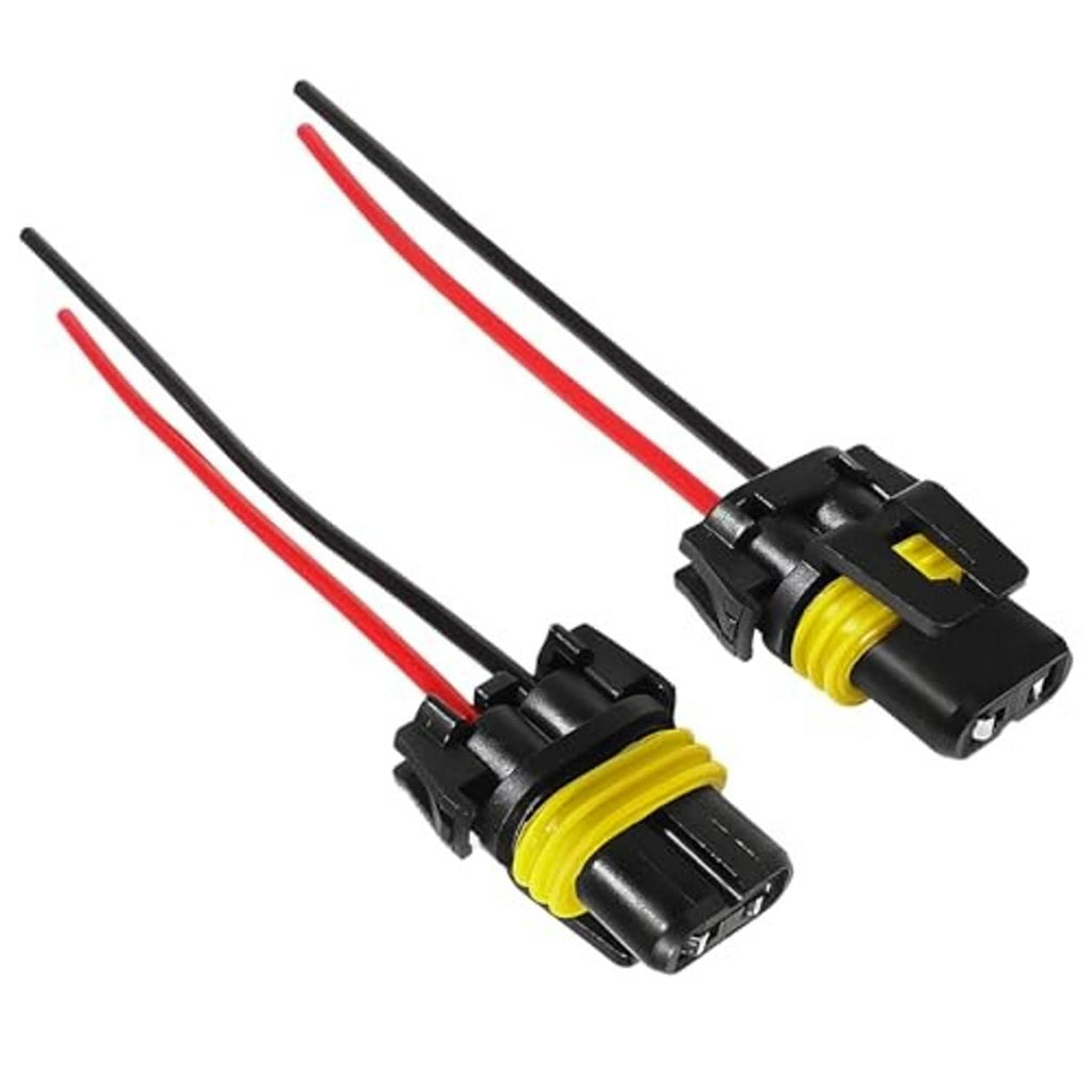Two headlight wiring harness female adapters with red and black wires and yellow inserts