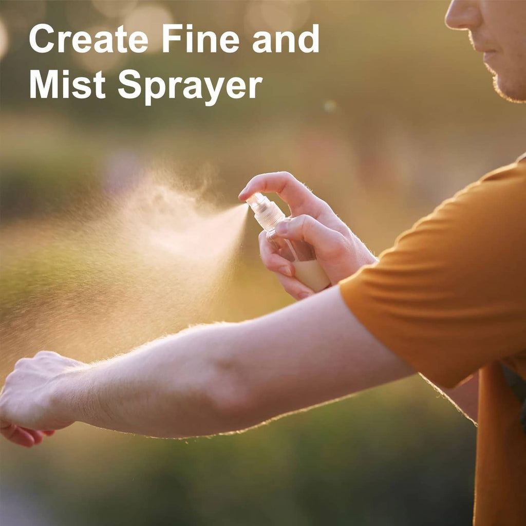Person using a fine mist spray top on a bottle, producing a mist spray