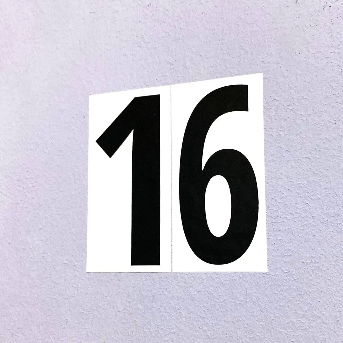 Black vinyl number stickers “1” and “6” on separate white squares