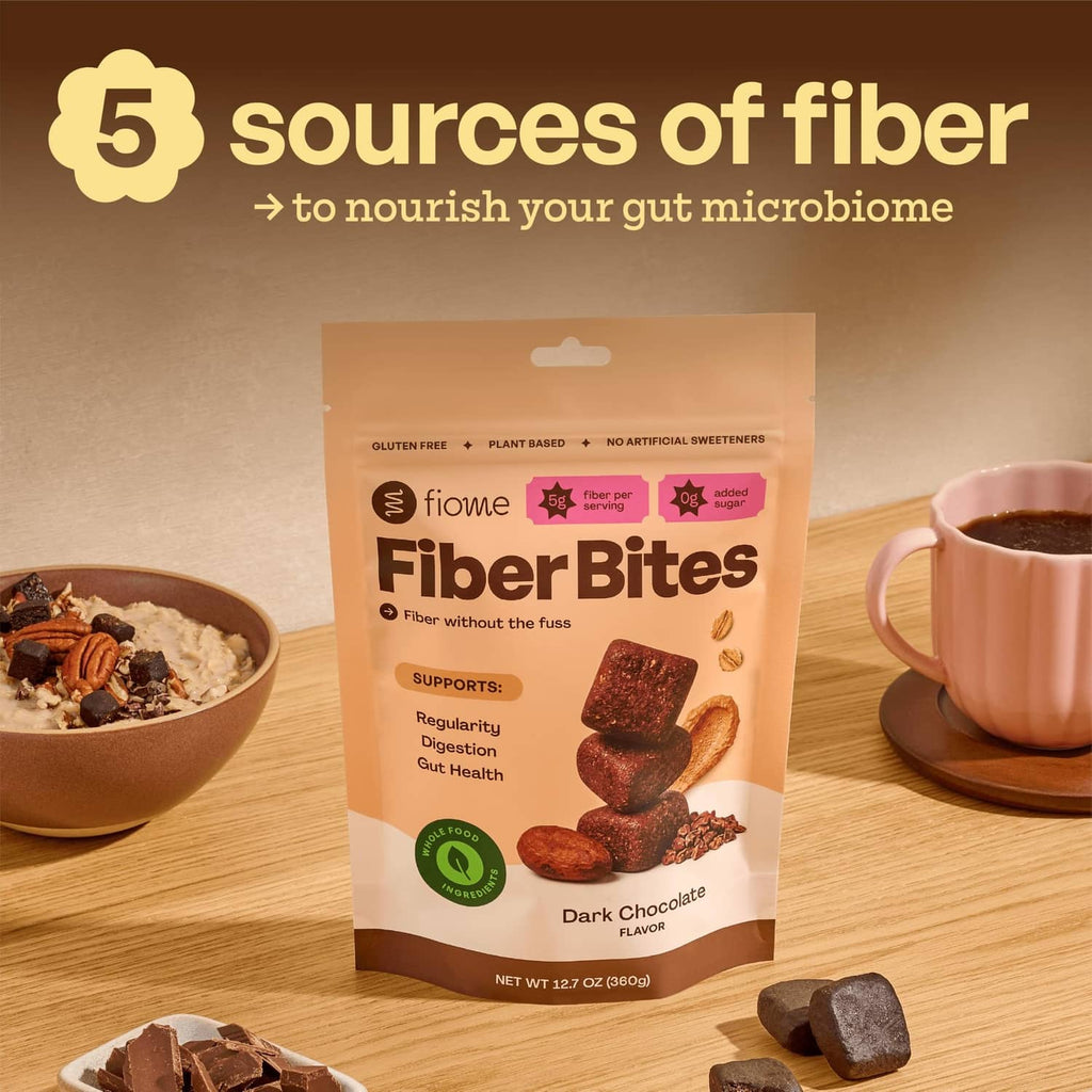 Fiome FiberBites dark chocolate pouch with stacked bites on a countertop