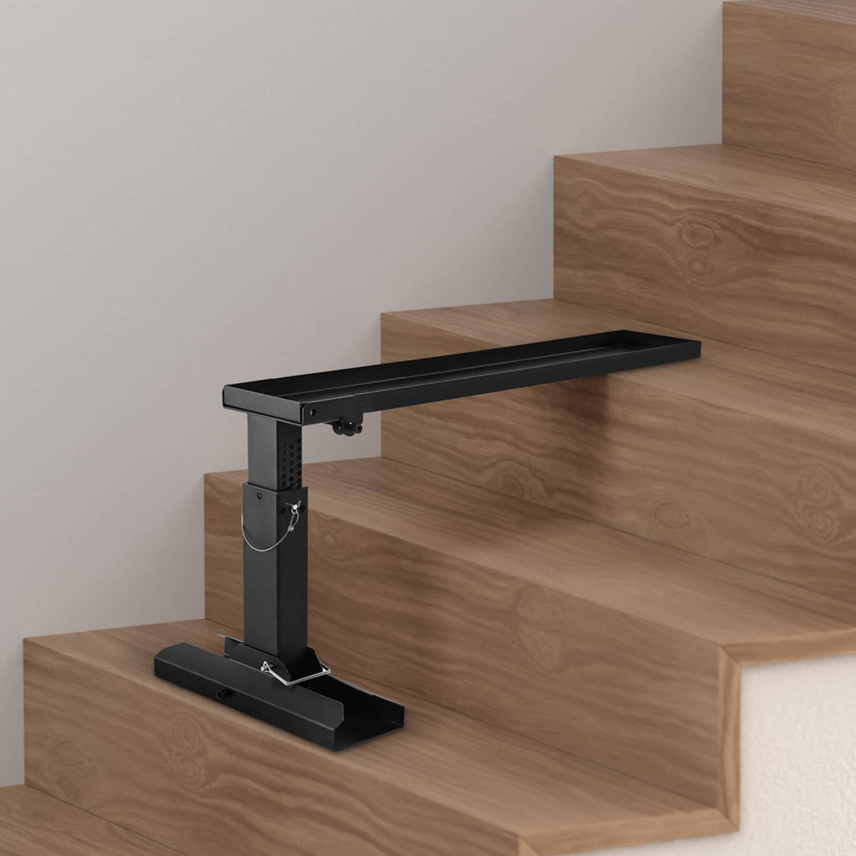 Black folding ladder stabilizer standing on base over wooden steps