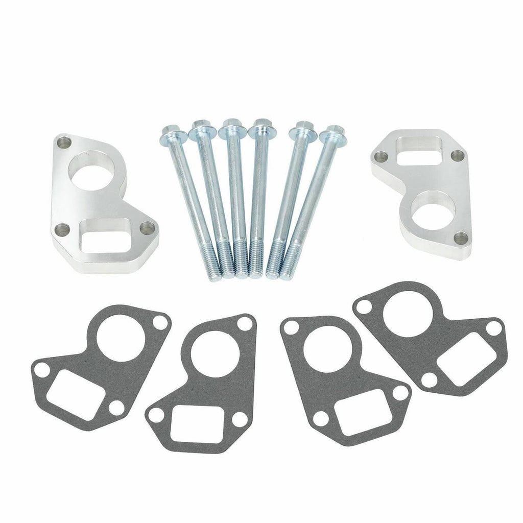 Water pump spacer adapter kit showing two silver brackets, bolts, and four gaskets