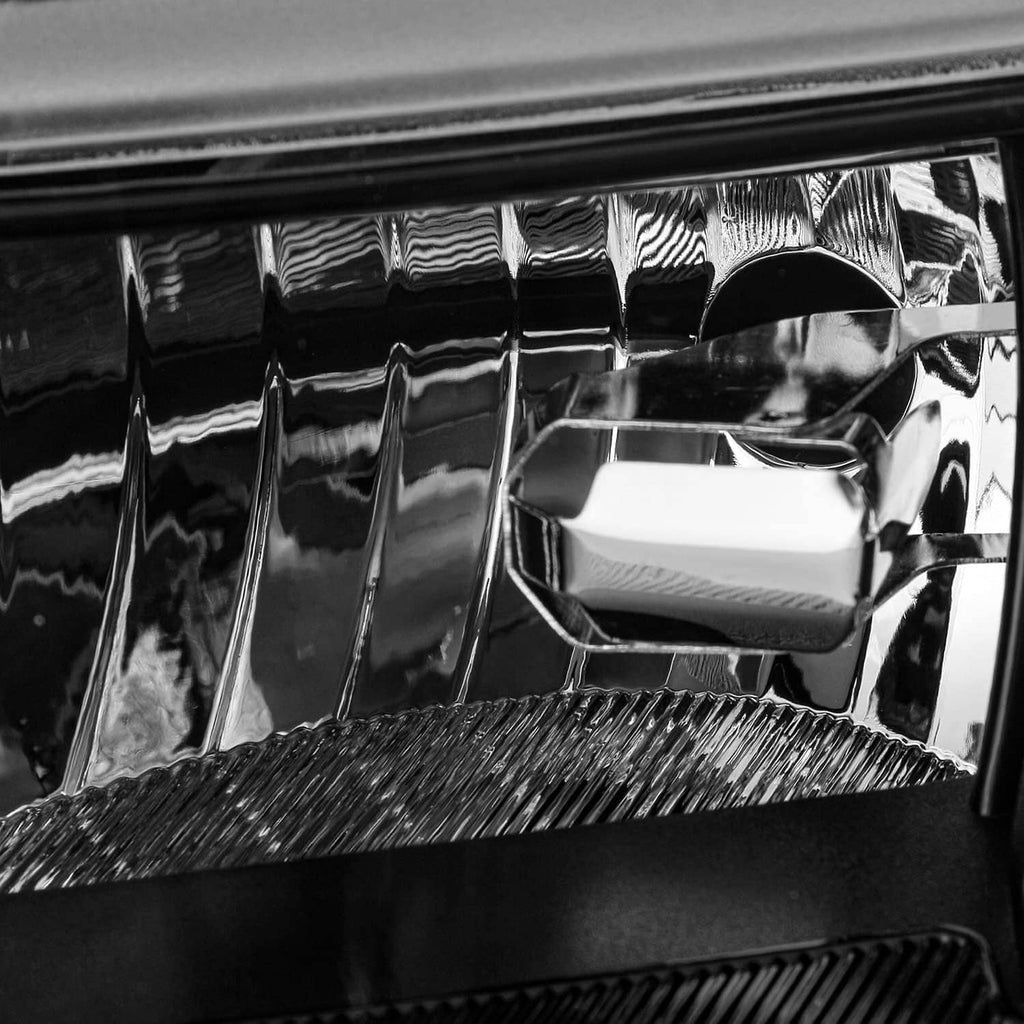 Close-up of LED headlight projector reflector and lens housing interior
