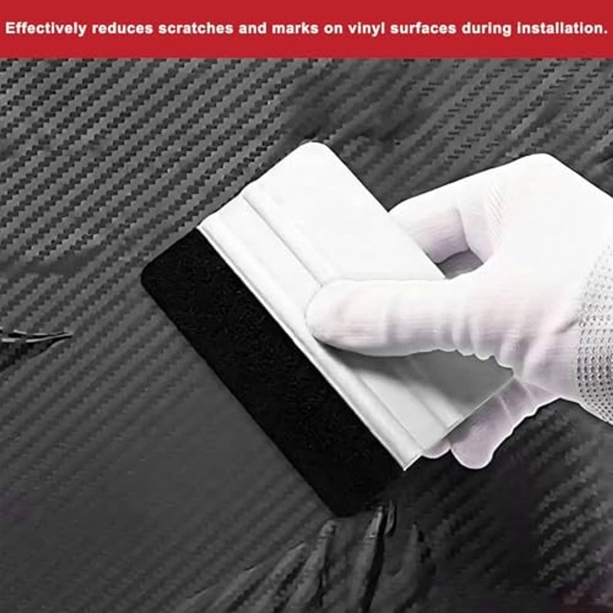 Plastic felt squeegee with white handle and black felt pad on vinyl surface