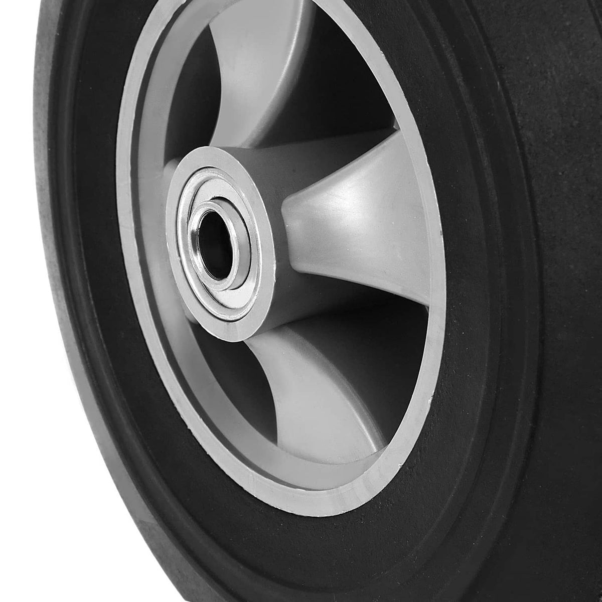 Close-up of wheel hub with central axle and gray 3-spoke design