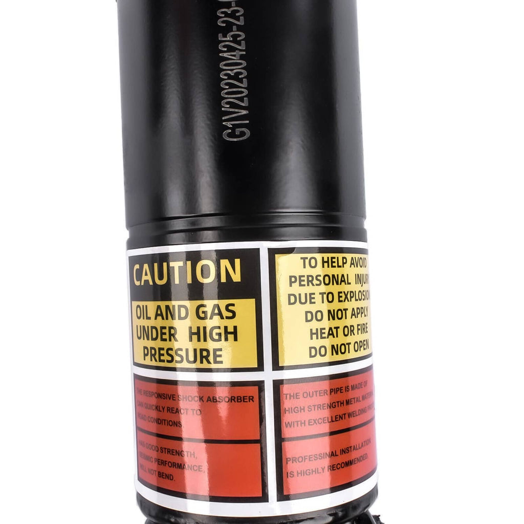 Black shock strut with caution oil-and-gas label and mounting band detail